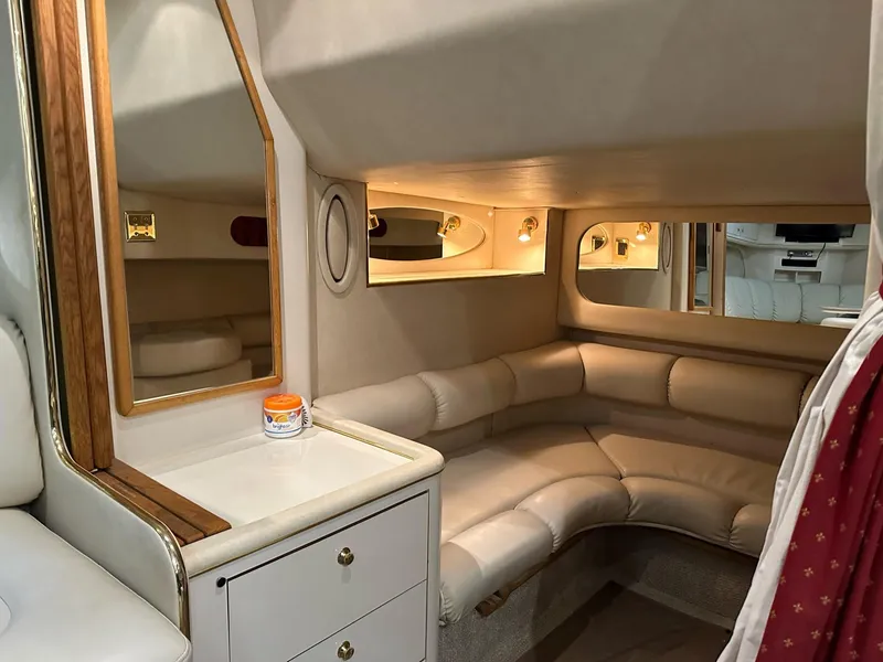 Slide: The Image of Luxurious interior of 1997 Sea Ray 370 Sundancer yacht with plush seating and elegant decor. - 14