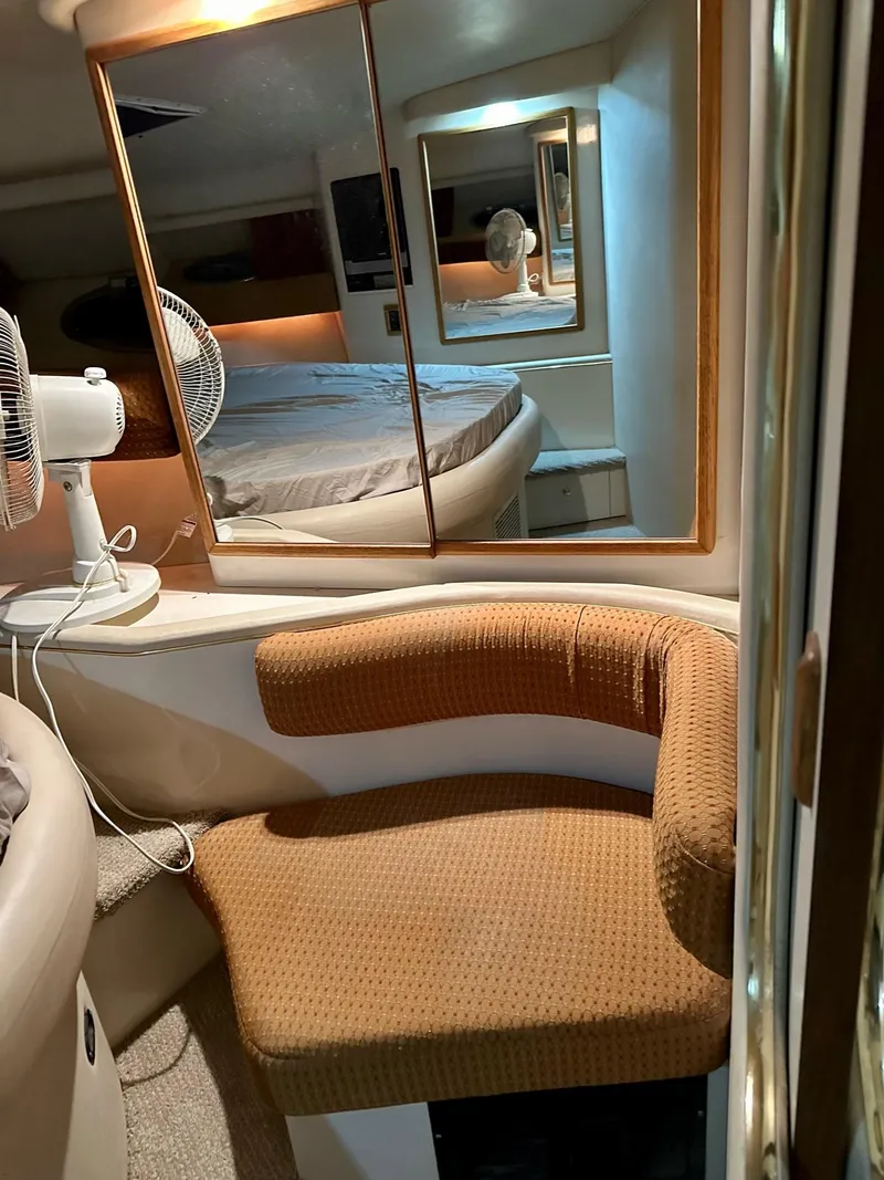 Slide: The Image of Interior of 1997 Sea Ray 370 Sundancer with seating, mirror, and fan. - 19