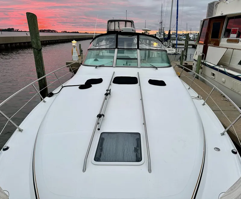 Slide: The Image of 1997 Sea Ray 370 Sundancer yacht docked at marina during sunset. - 21