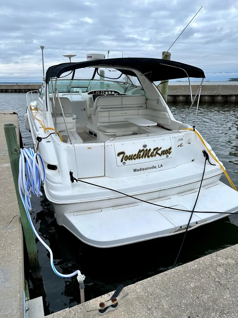 Slide: The Image of 1997 Sea Ray 370 Sundancer docked, featuring "Touch Me Knot" name, Madisonville, LA. - 24