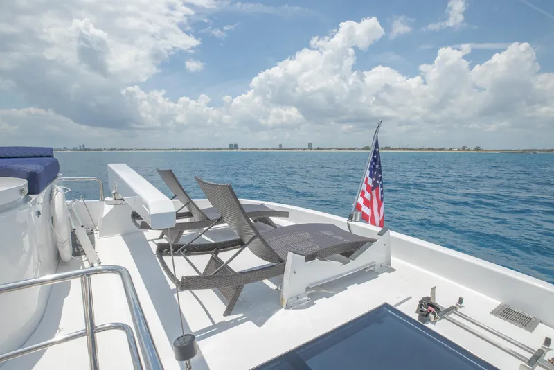Slide: The Image of Deck of 2005 Horizon 94 Motoryacht with lounge chairs and ocean view. - 14