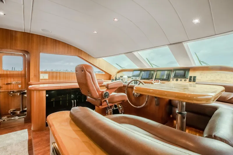 Slide: The Image of Luxurious helm station of 2005 Horizon 94 Motoryacht with leather seating and advanced navigation systems. - 22