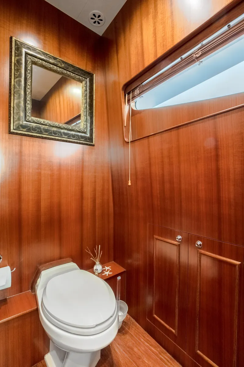Slide: The Image of Luxurious wooden bathroom on 2005 Horizon 94 Motoryacht with mirror and window. - 24