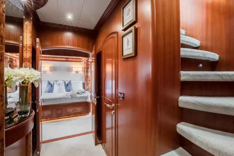 Slide: The Image of Luxurious interior of 2005 Horizon 94 Motoryacht with elegant wood paneling and cozy bedroom. - 25