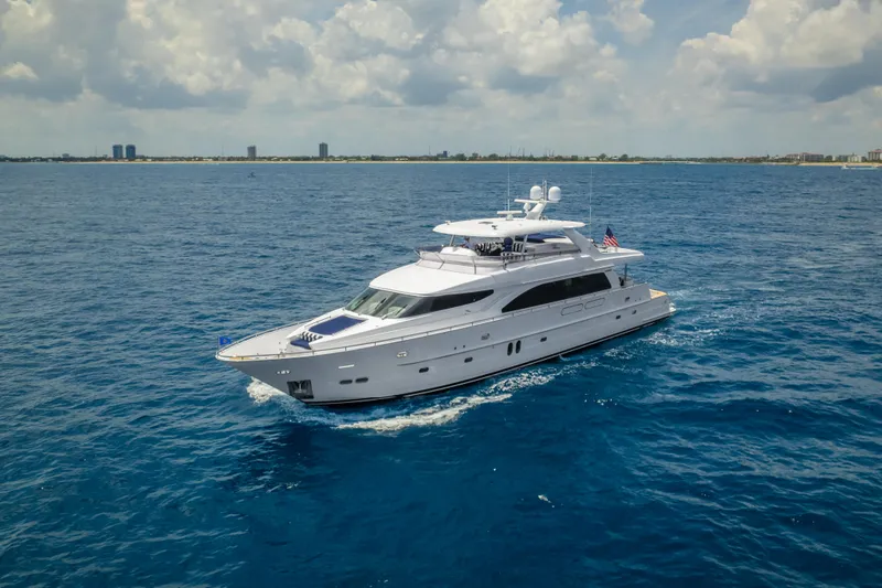 Slide: The Image of 2005 Horizon 94 Motoryacht cruising on open water under a partly cloudy sky. - 3