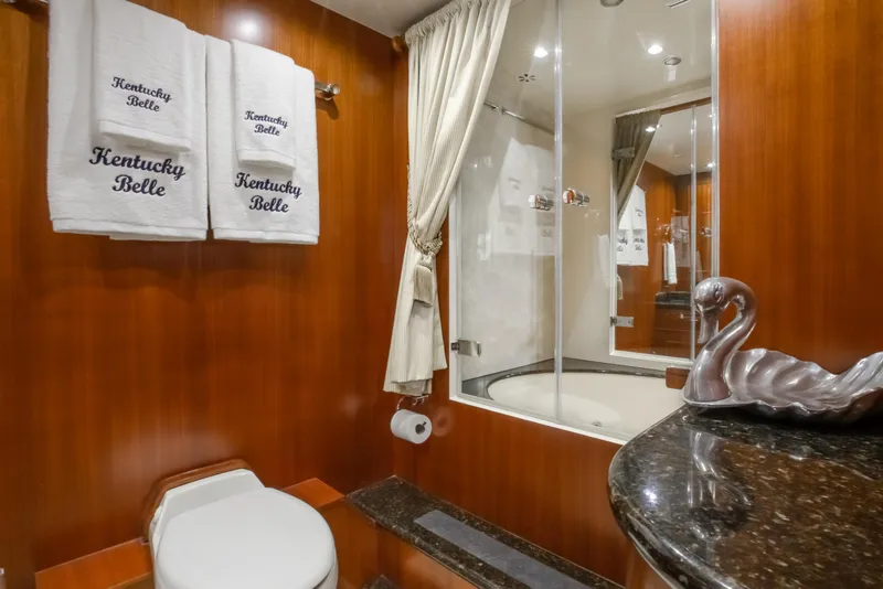 Slide: The Image of Luxurious bathroom on 2005 Horizon 94 Motoryacht with elegant decor and swan sculpture. - 32