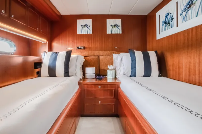 Slide: The Image of Luxurious twin cabin on 2005 Horizon 94 Motoryacht with elegant wood finish and modern decor. - 35