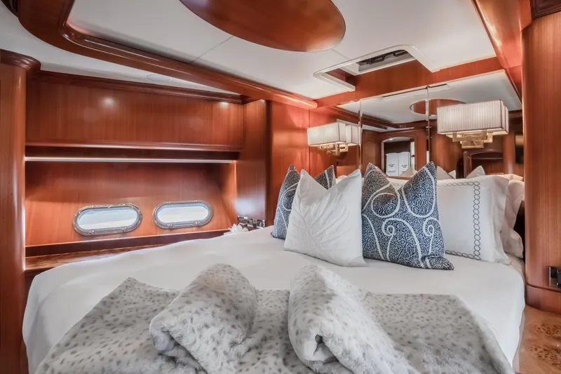 Slide: The Image of Luxurious bedroom interior of 2005 Horizon 94 Motoryacht with plush bedding and elegant wood finishes. - 39
