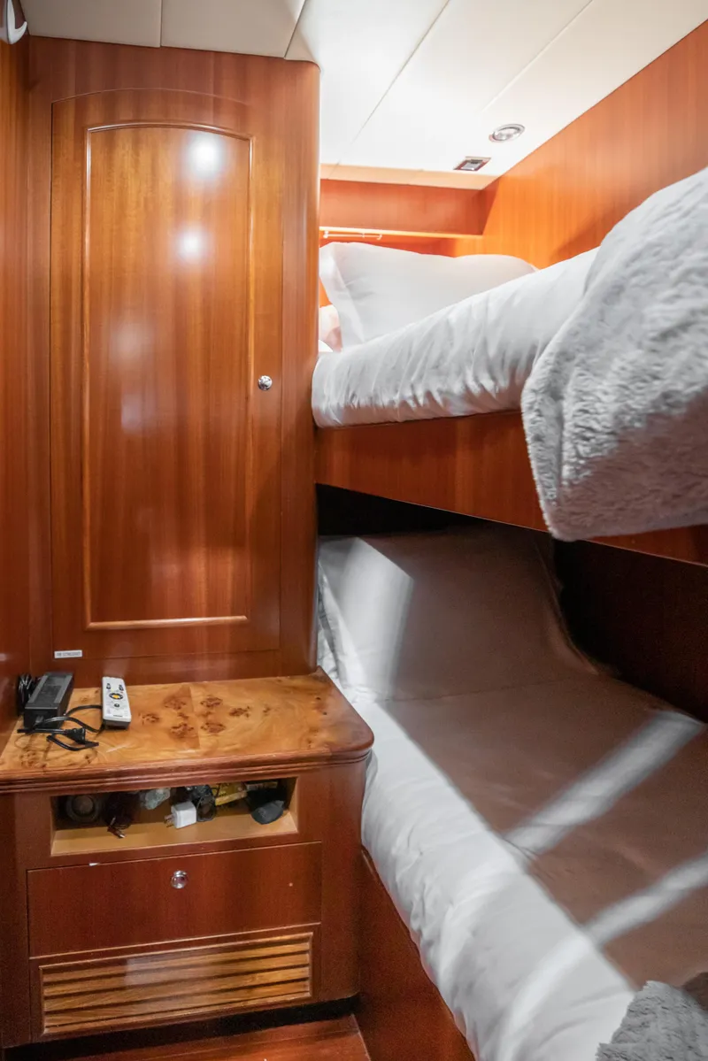Slide: The Image of Bunk beds in the cabin of a 2005 Horizon 94 Motoryacht. - 42