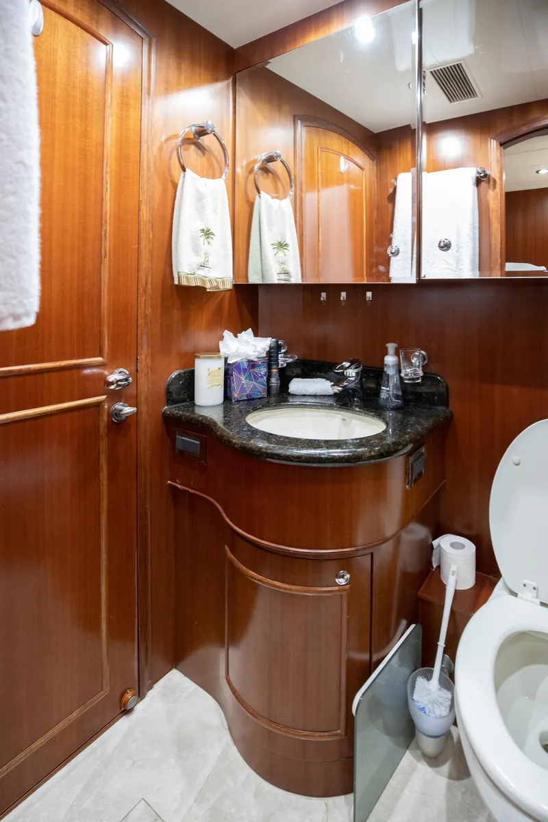 Slide: The Image of Luxurious bathroom on a 2005 Horizon 94 Motoryacht with wooden cabinetry and modern fixtures. - 43