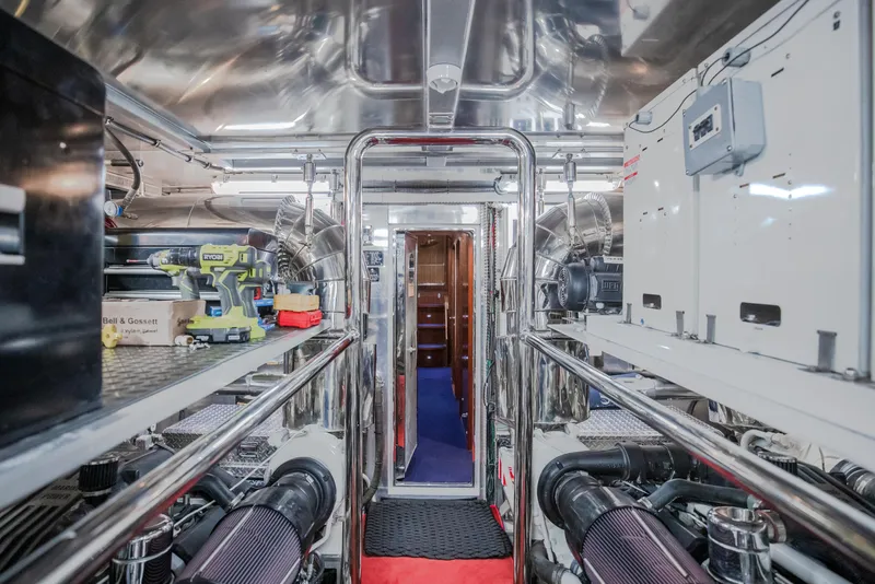Slide: The Image of Engine room of a 2005 Horizon 94 Motoryacht with polished metal surfaces and equipment. - 49