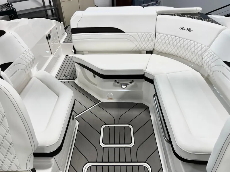 Slide: The Image of 2024 Sea Ray SLX 260 boat interior with luxurious white seating and modern design. - 13
