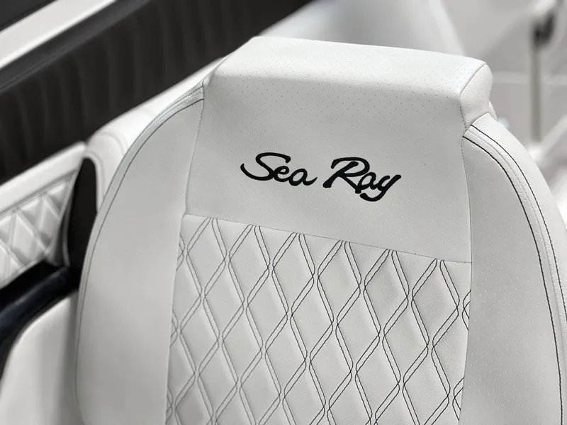 Slide: The Image of 2024 Sea Ray SLX 260 seat with diamond stitching and embroidered logo. - 15
