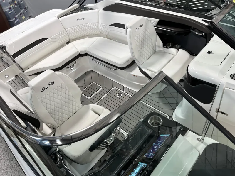 Slide: The Image of 2024 Sea Ray SLX 260 boat interior with luxurious white seating and modern design. - 16
