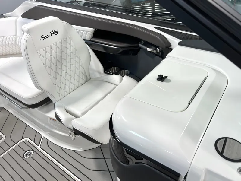 Slide: The Image of 2024 Sea Ray SLX 260 interior with white leather seating and modern design. - 17