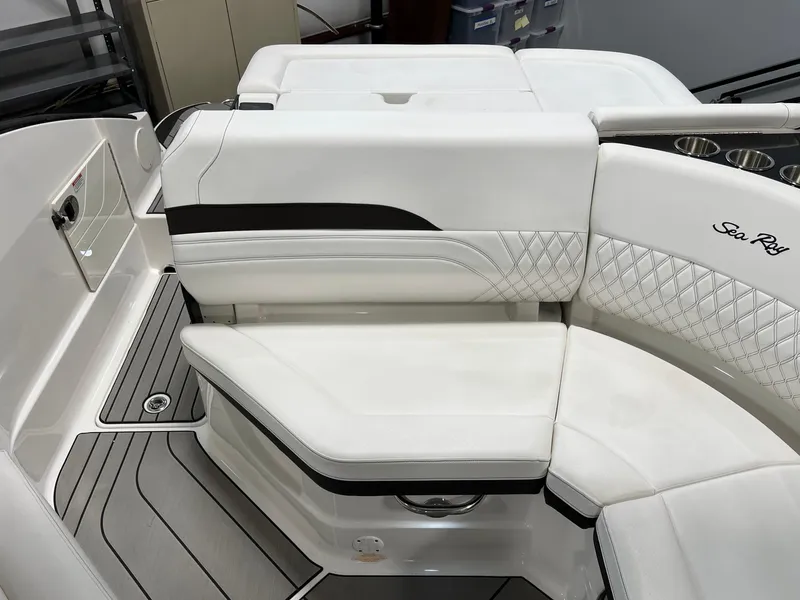 Slide: The Image of 2024 Sea Ray SLX 260 boat interior with white leather seating and elegant design. - 18