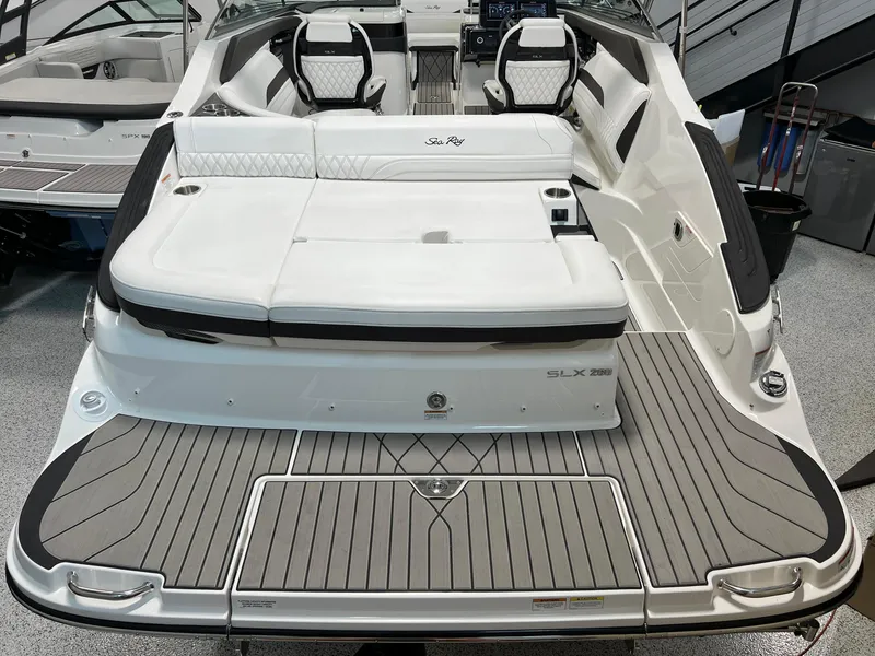 Slide: The Image of 2024 Sea Ray SLX 260 boat with sleek design and spacious seating. - 26
