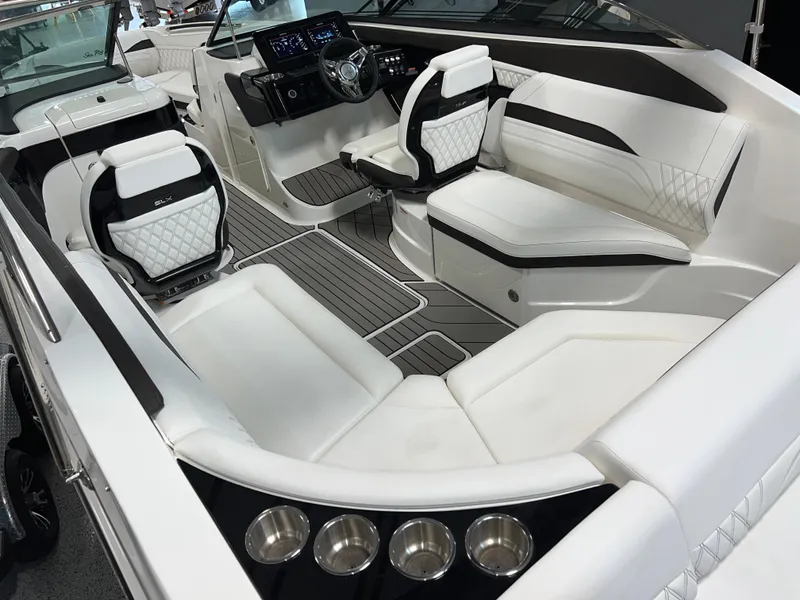 Slide: The Image of 2024 Sea Ray SLX 260 boat interior with luxurious white seating and modern dashboard. - 32