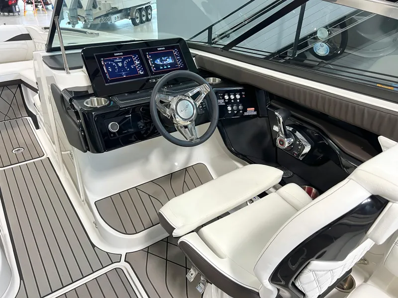 Slide: The Image of 2024 Sea Ray SLX 260 helm with modern controls and sleek design. - 35
