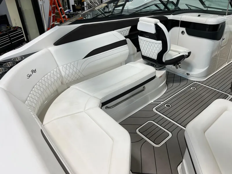 Slide: The Image of 2024 Sea Ray SLX 260 boat interior with white seating and modern design. - 38