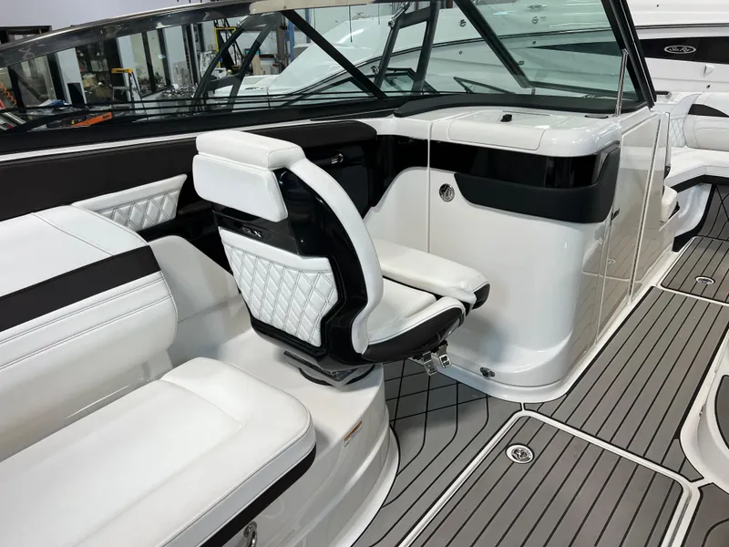Slide: The Image of 2024 Sea Ray SLX 260 interior with luxurious white seating and modern design. - 39