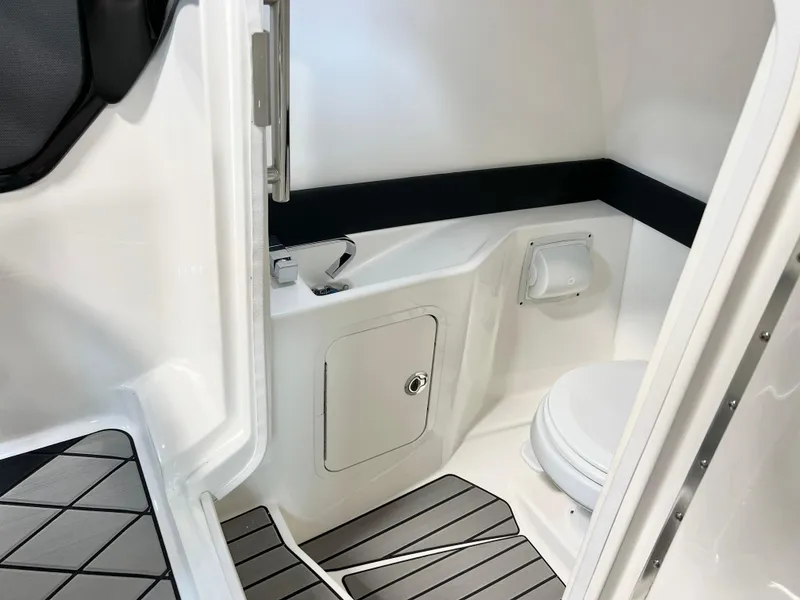 Slide: The Image of 2024 Sea Ray SLX 260 boat interior bathroom with modern fixtures and sleek design. - 42