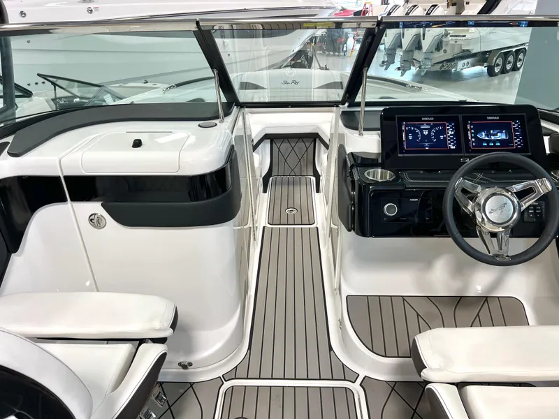 Slide: The Image of 2024 Sea Ray SLX 260 boat interior with modern dashboard and sleek design. - 44
