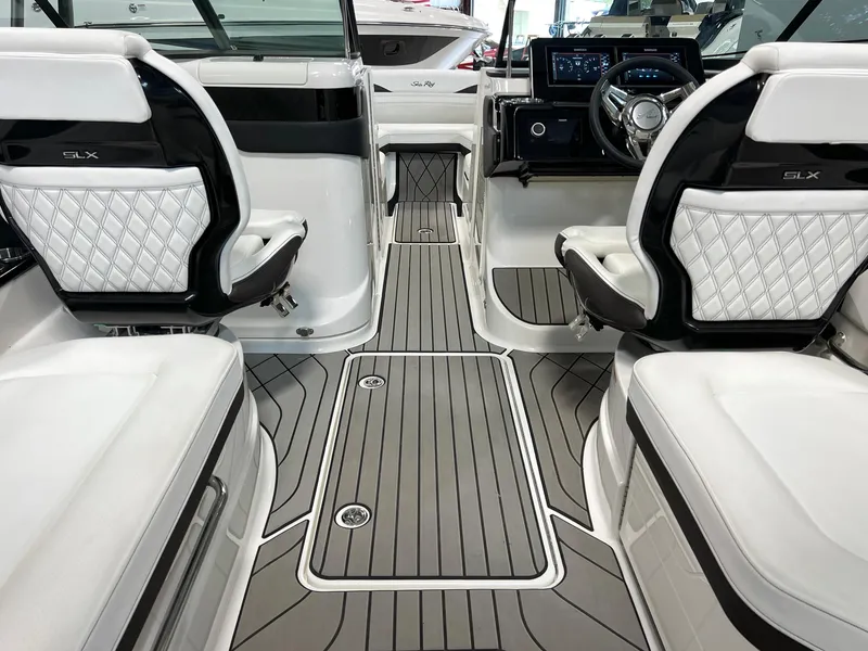 Slide: The Image of 2024 Sea Ray SLX 260 interior with luxurious seating and modern dashboard. - 45