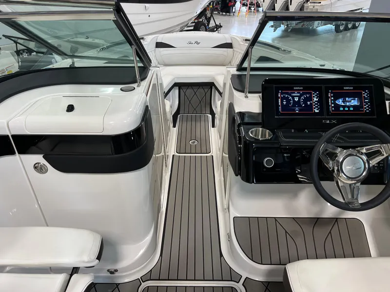 Slide: The Image of 2024 Sea Ray SLX 260 boat interior with modern dashboard and sleek design. - 47