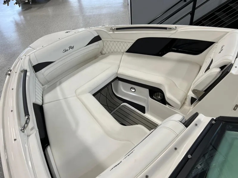 Slide: The Image of 2024 Sea Ray SLX 260 boat interior with luxurious white seating and sleek design. - 50