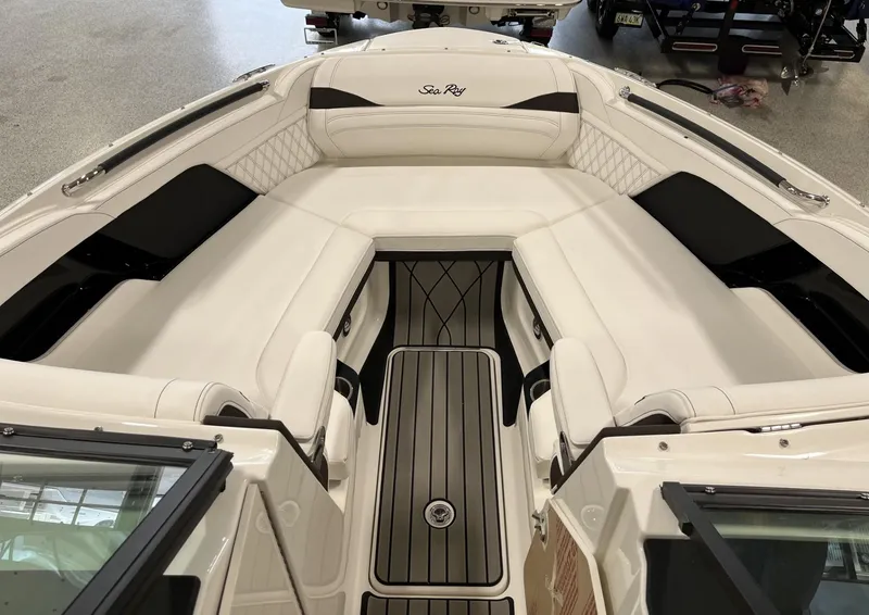 Slide: The Image of 2024 Sea Ray SLX 260 boat interior with white seating and black accents. - 65