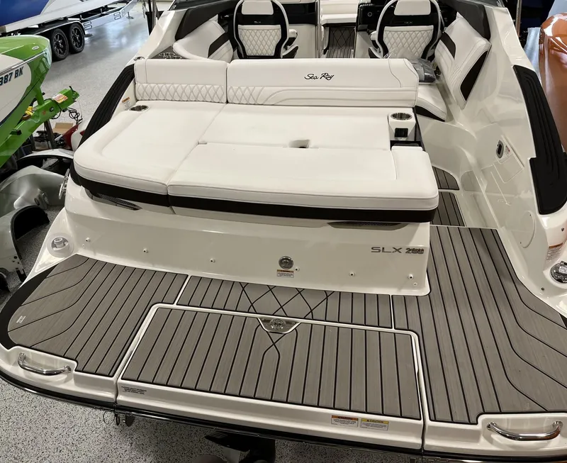 Slide: The Image of 2024 Sea Ray SLX 260 boat with luxurious seating and spacious deck. - 76