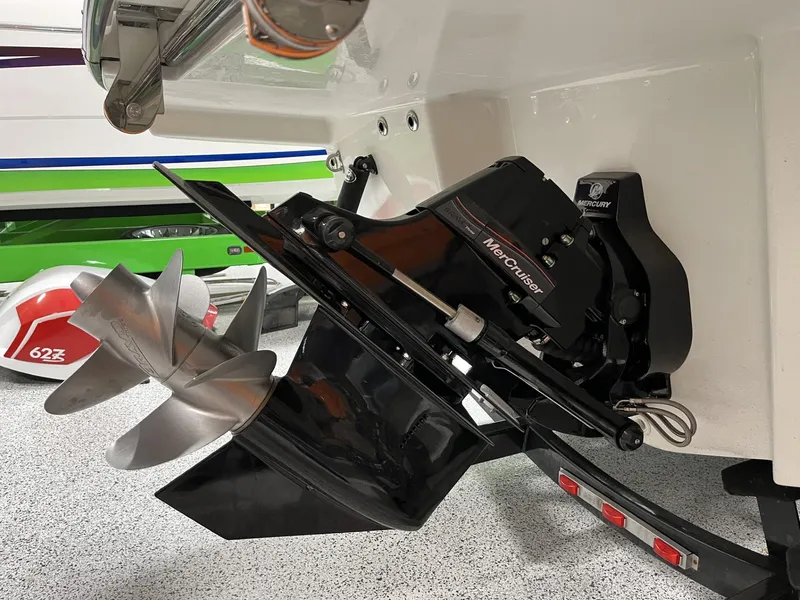 Slide: The Image of Close-up of 2024 Sea Ray SLX 260 boat's MerCruiser propeller and outdrive. - 77