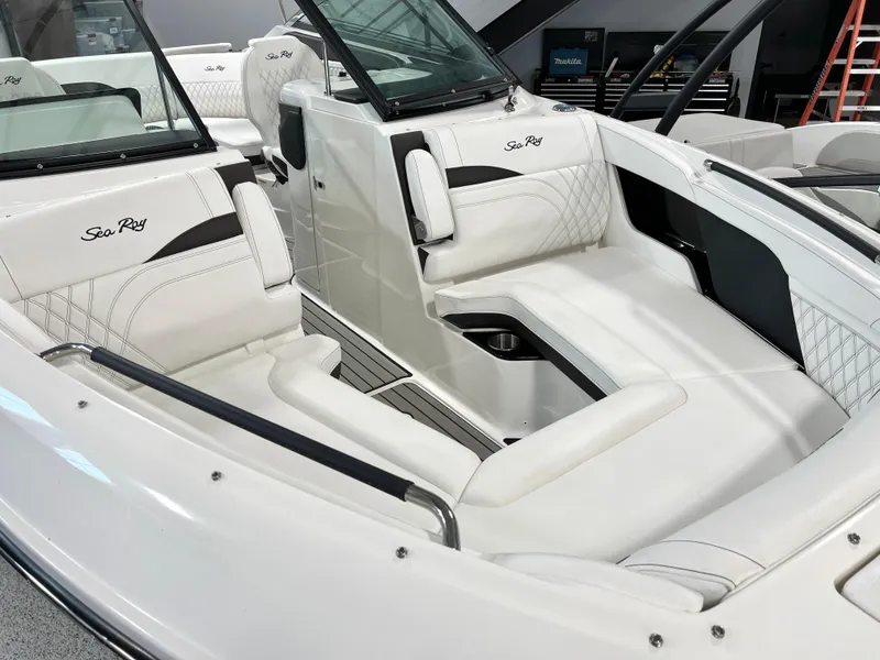 Slide: The Image of 2024 Sea Ray SLX 260 boat interior with luxurious white seating and sleek design. - 9