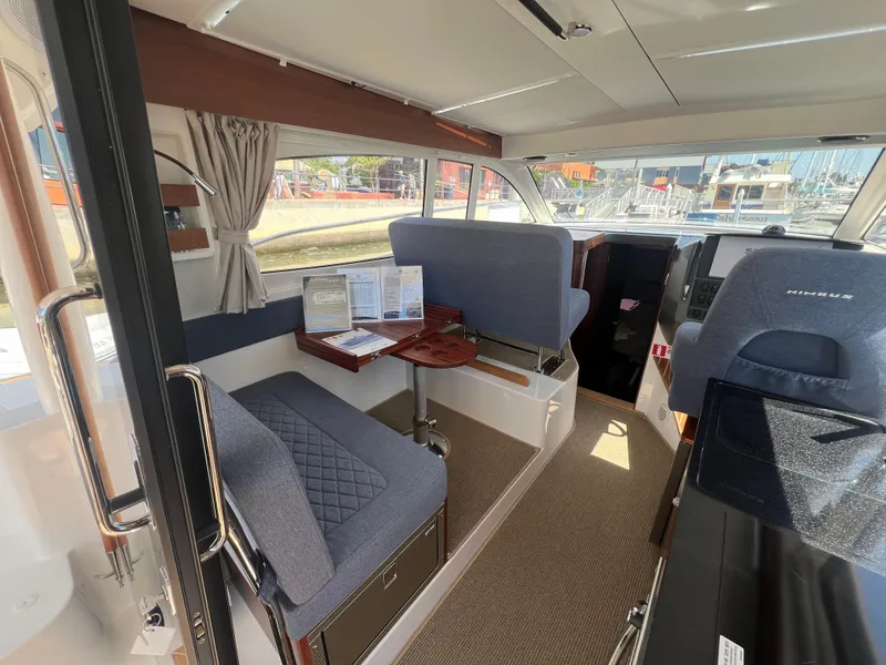 Slide: The Image of Interior of 2024 Nimbus 305 Coupe, featuring modern seating and navigation area. - 12