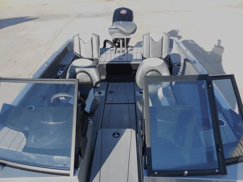 Slide: The Image of 2024 Vexus ADX 180 boat interior with open windshield and seating. - 6