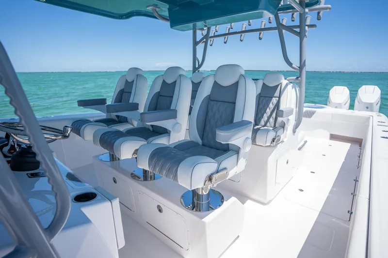 Slide: The Image of 2024 Invincible 46 Catamaran interior with luxurious seating and ocean view. - 13
