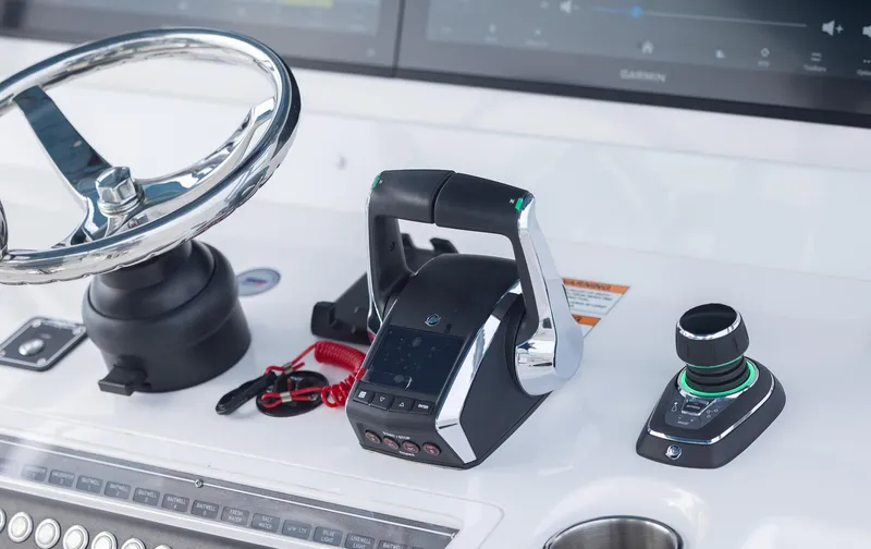 Slide: The Image of 2024 Invincible 46 Catamaran helm with modern controls and steering wheel. - 17