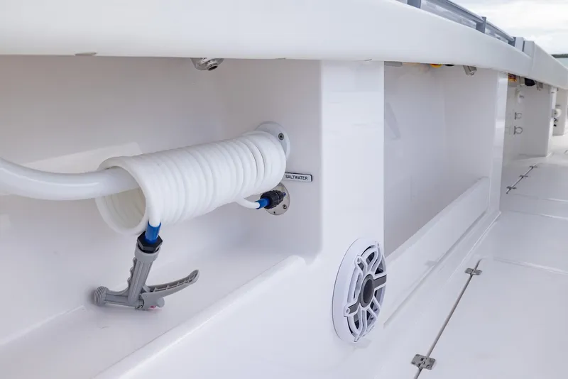 Slide: The Image of 2024 Invincible 46 Catamaran deck detail with coiled hose and speaker. - 22