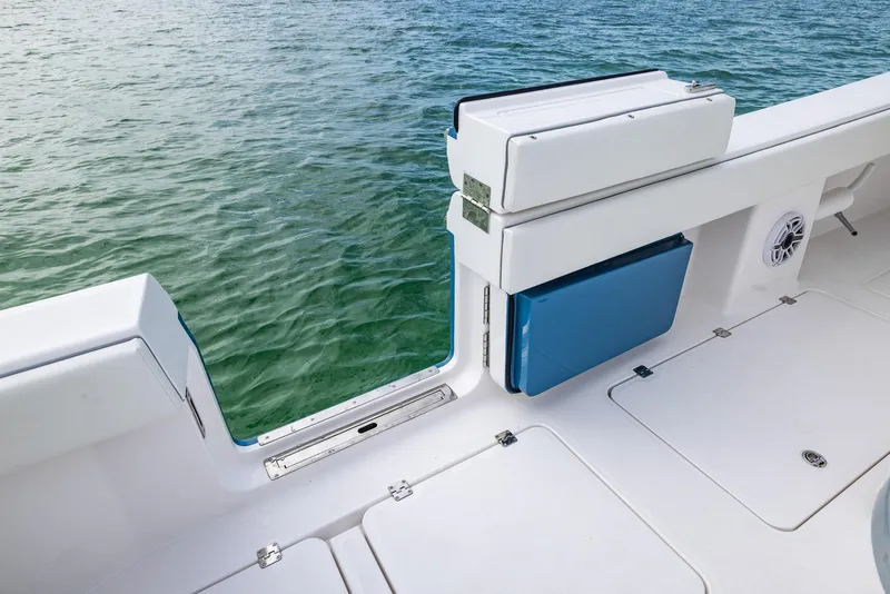 Slide: The Image of 2024 Invincible 46 Catamaran deck with open side door, overlooking calm water. - 30
