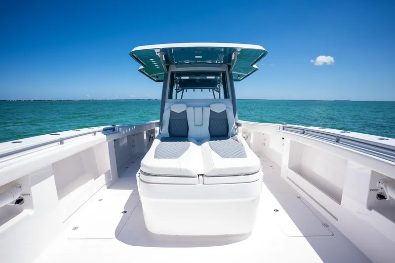 Slide: The Image of 2024 Invincible 46 Catamaran on open water, showcasing sleek design and spacious deck. - 9