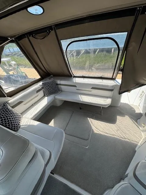 Slide: The Image of Spacious interior of a 2000 Formula 41 PC boat with comfortable seating and large windows. - 10