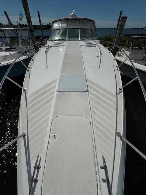 Slide: The Image of 2000 Formula 41 PC boat docked at a marina. - 18