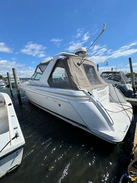 Slide: The Image of 2000 Formula 41 PC yacht docked at marina on a sunny day. - 2