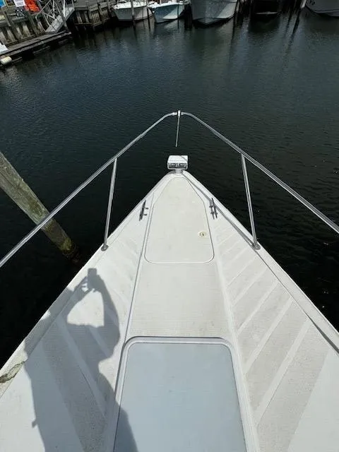 Slide: The Image of Bow of a 2000 Formula 41 PC yacht docked at a marina. - 20