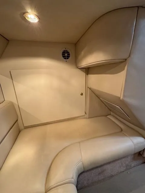 Slide: The Image of Interior cabin of 2000 Formula 41 PC boat with beige leather seating. - 22