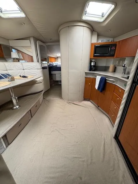 Slide: The Image of Interior of a 2000 Formula 41 PC yacht with kitchen and seating area. - 26