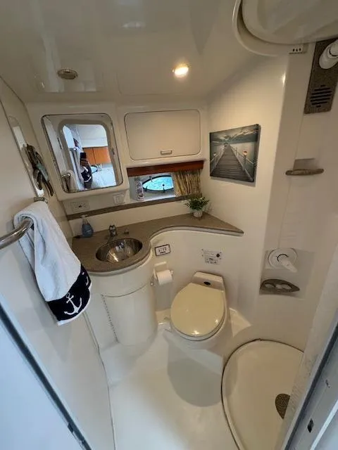 Slide: The Image of 2000 Formula 41 PC boat bathroom with sink, toilet, and shower. - 31