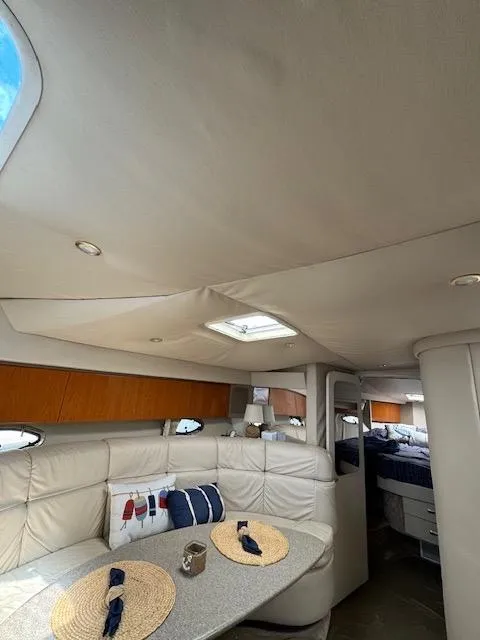 Slide: The Image of Interior of 2000 Formula 41 PC yacht with cozy seating and dining area. - 35