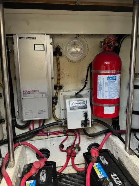 Slide: The Image of Engine compartment of a 2000 Formula 41 PC boat with battery system and fire extinguisher. - 40